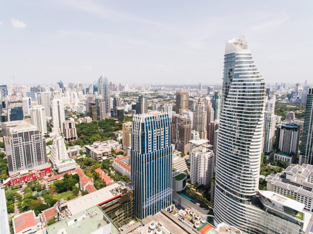 Panoramic aerial view showcasing modern skyscrapers in a bustling city skyline.