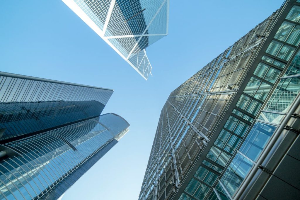 Modern skyscrapers captured from below, showcasing Hong Kongs urban architecture.